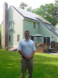 Tom Rummel, SolarFlair residential sales associate, is conducting the site evaluations for the discount Solarize Mass Bolton program. Behind him is an independent SolarFlair project the company installed on South Bolton Road.  Courtesy Barbara Parente 