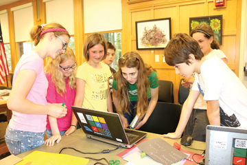Students review a stop-motion animation created during a MakerDay event at the Bolton Public Library. A lead instructor from Empow Studios of Lexington brought the equipment and led the training. The library aims to increase the number of professionally-led tech and arts workshops.                                                                                                               Kristin DeJohn
